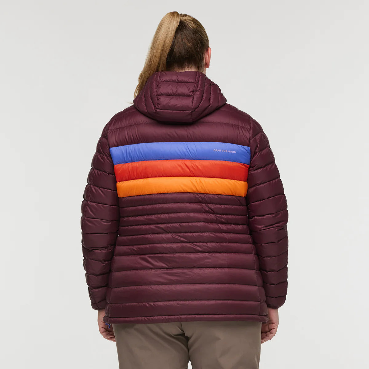 Back view of plus size woman wearing Cotopaxi Fuego Down Plus Size Hooded Jacket in Wine Stripes