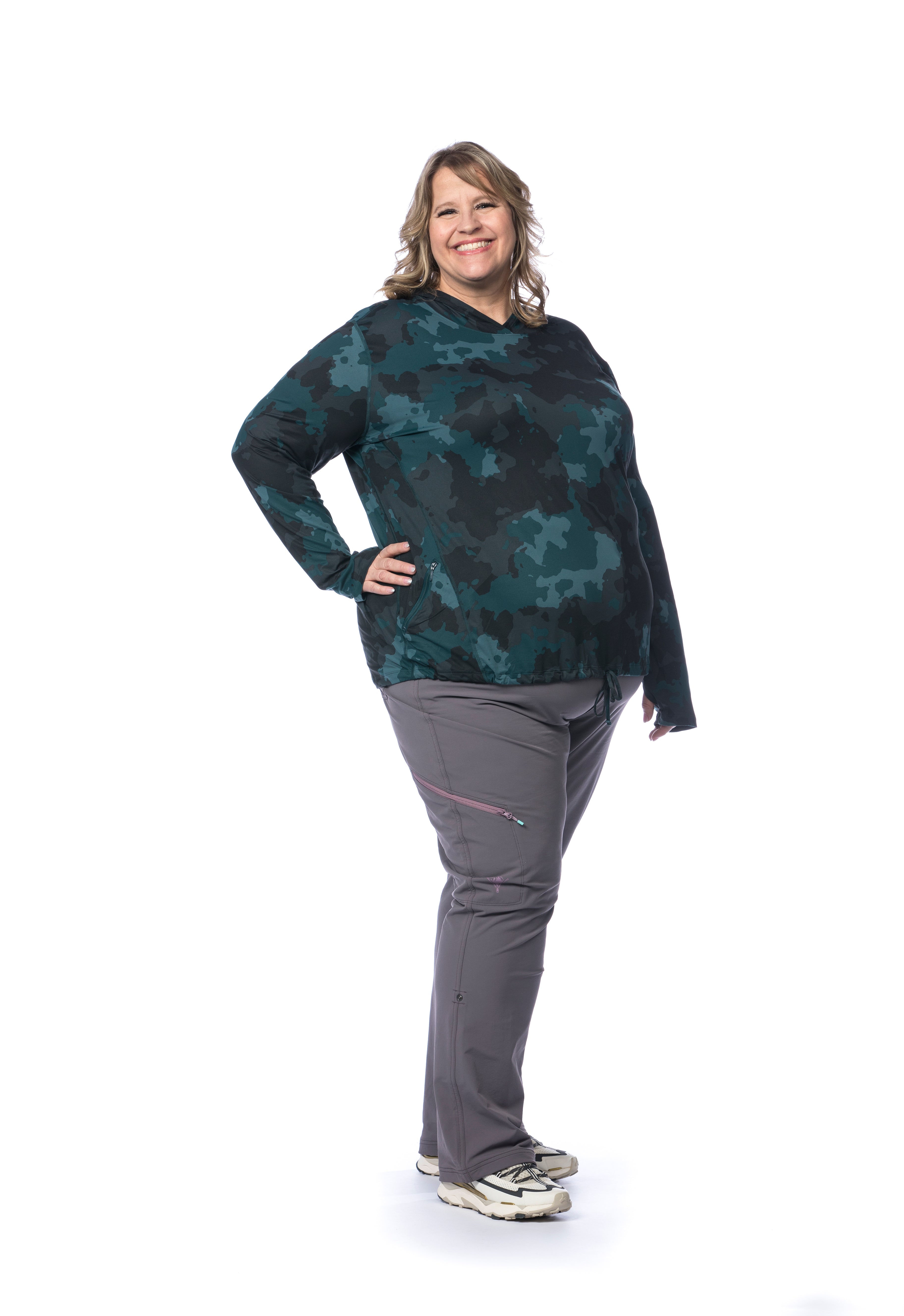 Plus size woman wearing the Mountain Hardwear Crater Lake Plus Size LS Hoody in Dark Marsh Pines Camo