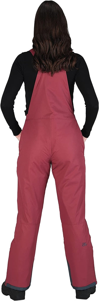 Back view of woman Arctix snow bibs in crimson