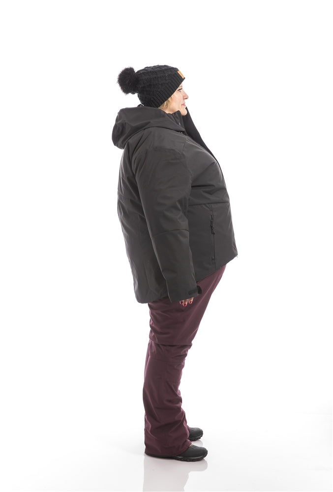 Kindra wearing a Swiss System 3 in one jacket over Groove Bibs right side view