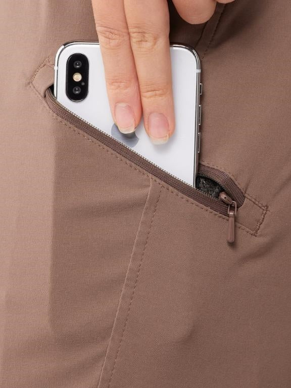 Close up of zippered pocket of Mountain Hardwear Dynama/2 Ankle Plus Size Pants in Choss