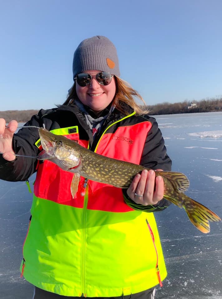 Lauren From the KinsaFamily Holding a Fish Wearing a DSG Winter Jacket