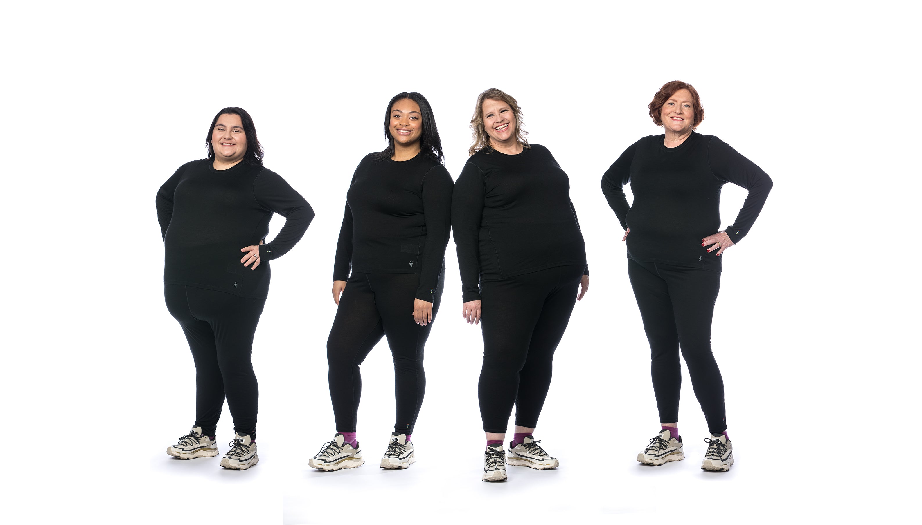 four plus size women wearing black base layers by Smartwool