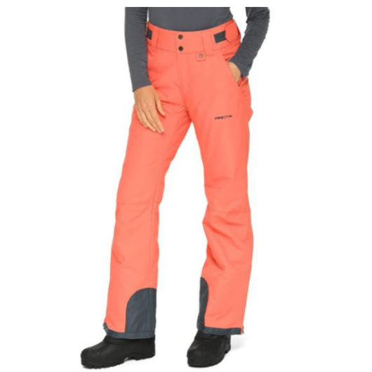 Front view of woman wearing Arctix Plus Size Snow Pants in Spice